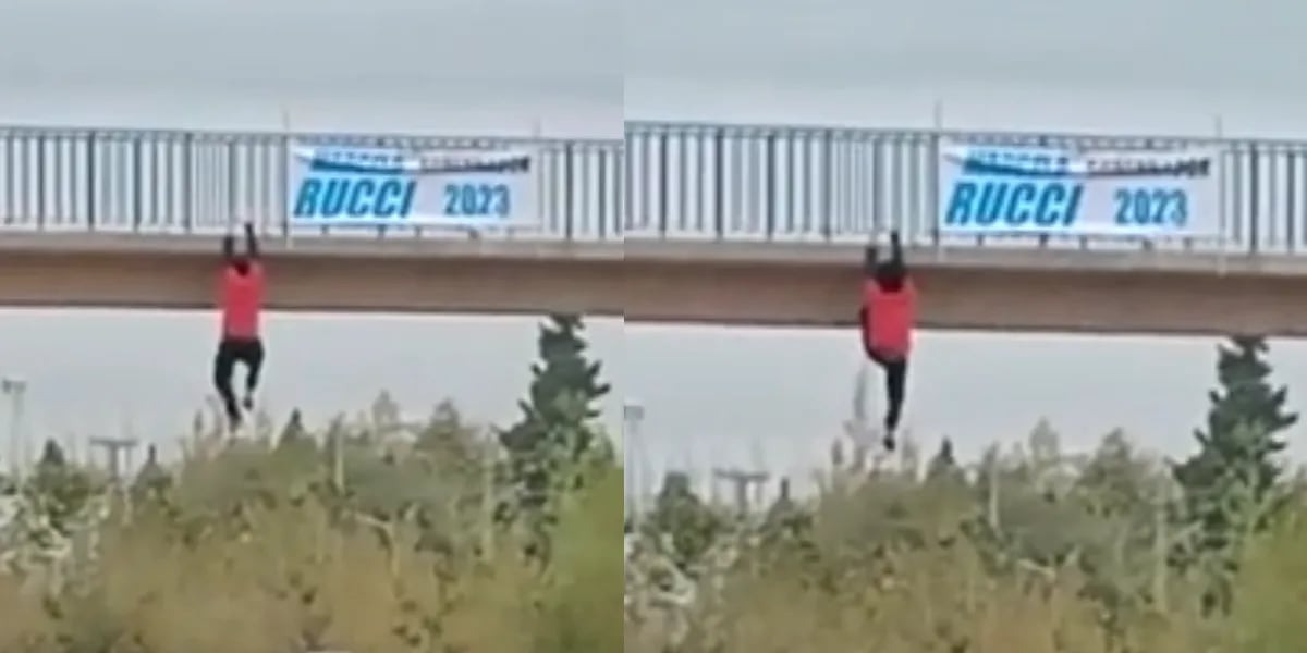 Quiso colgar un cartel, perdió el equilibrio y quedó colgando de un puente por varios minutos